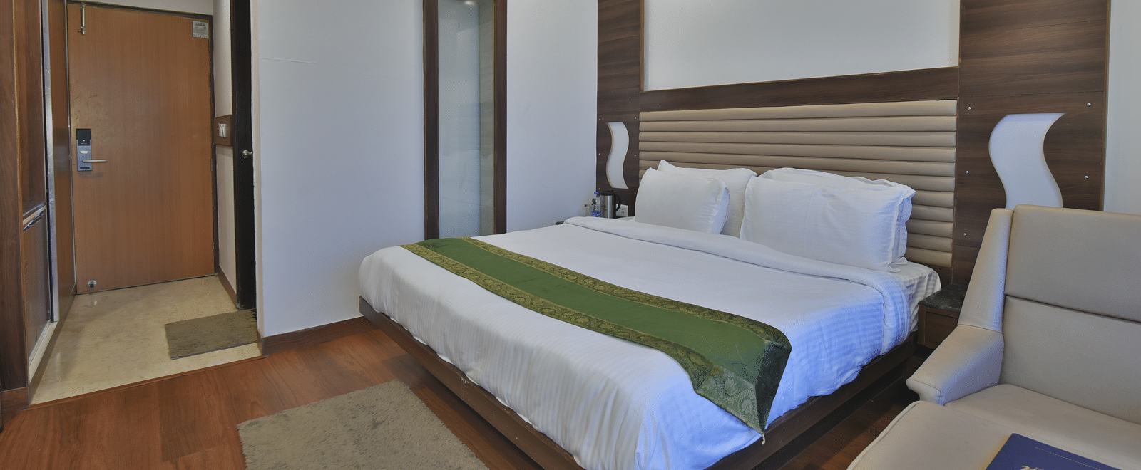 A view of the large bed in the Premium Room at DLS Highland Resort and Spa, Mussoorie.